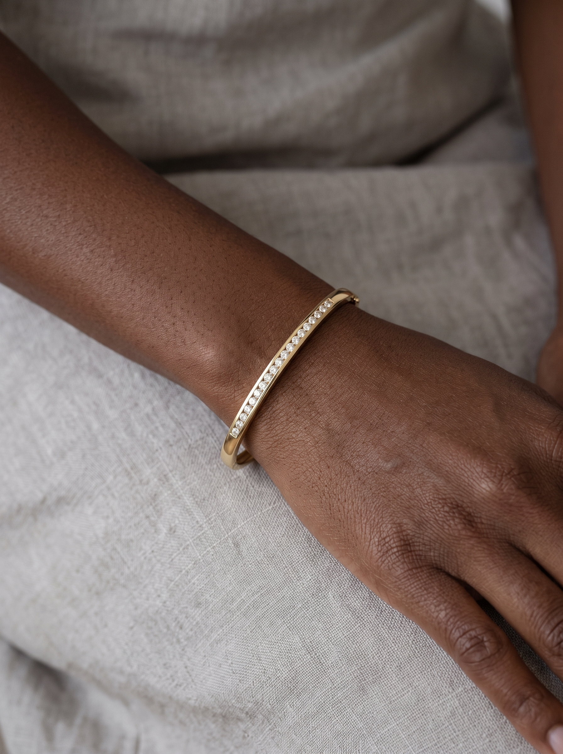 Natural Diamond Inlay Bangle in 14K Yellow Gold, worn on the wrist
