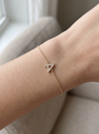Natural Diamond Pavé Initial Bracelet in 14K Yellow Gold, shown close on the wrist