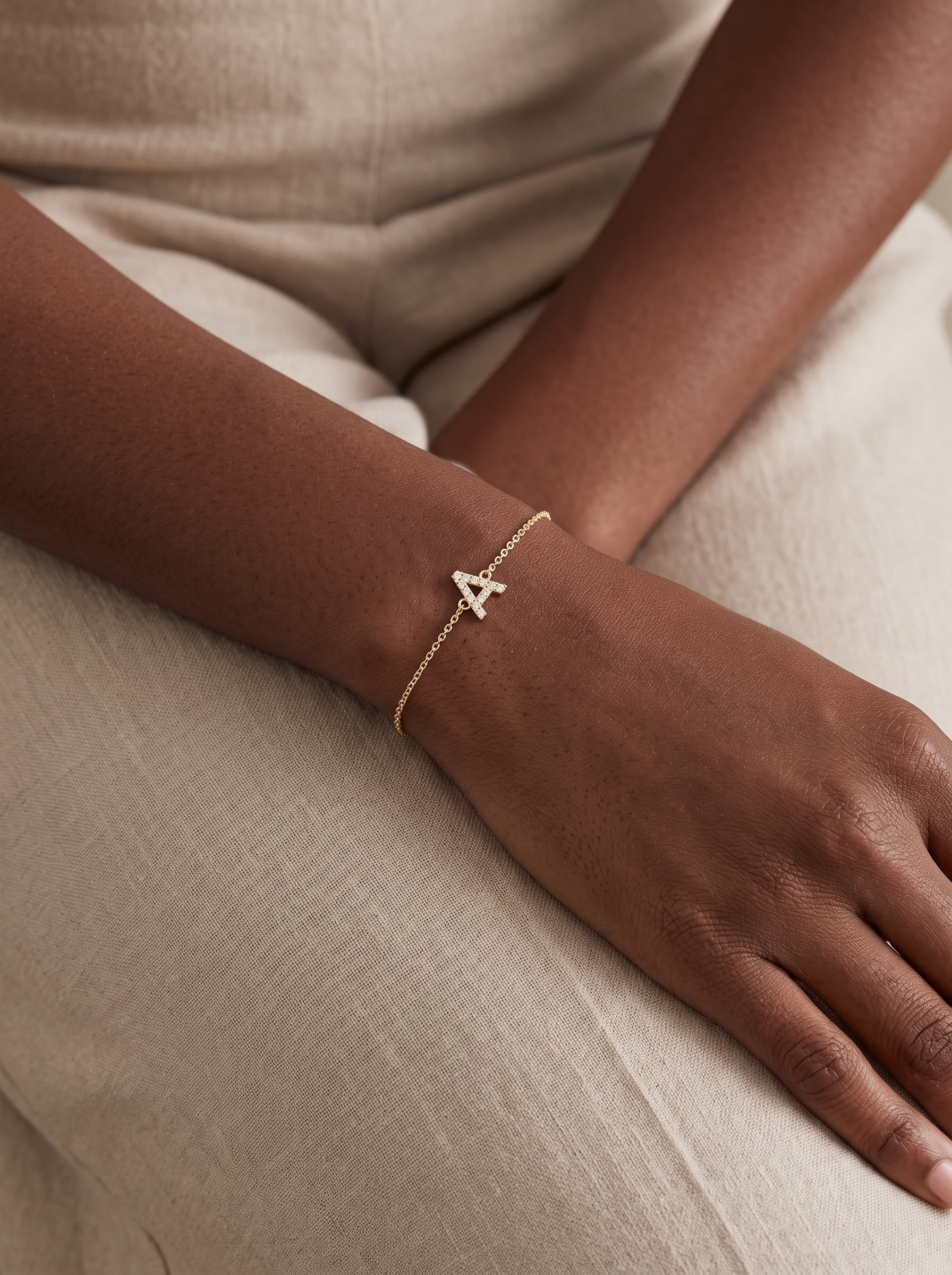 Natural Diamond Pavé Initial Bracelet in 14K Yellow Gold, worn on the wrist