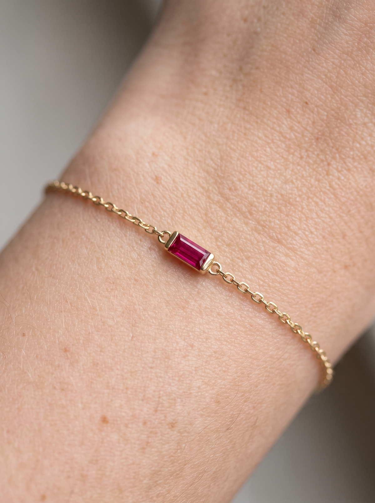 Natural Gemstone Baguette Bracelet in 14K Yellow Gold, shown close on the wrist