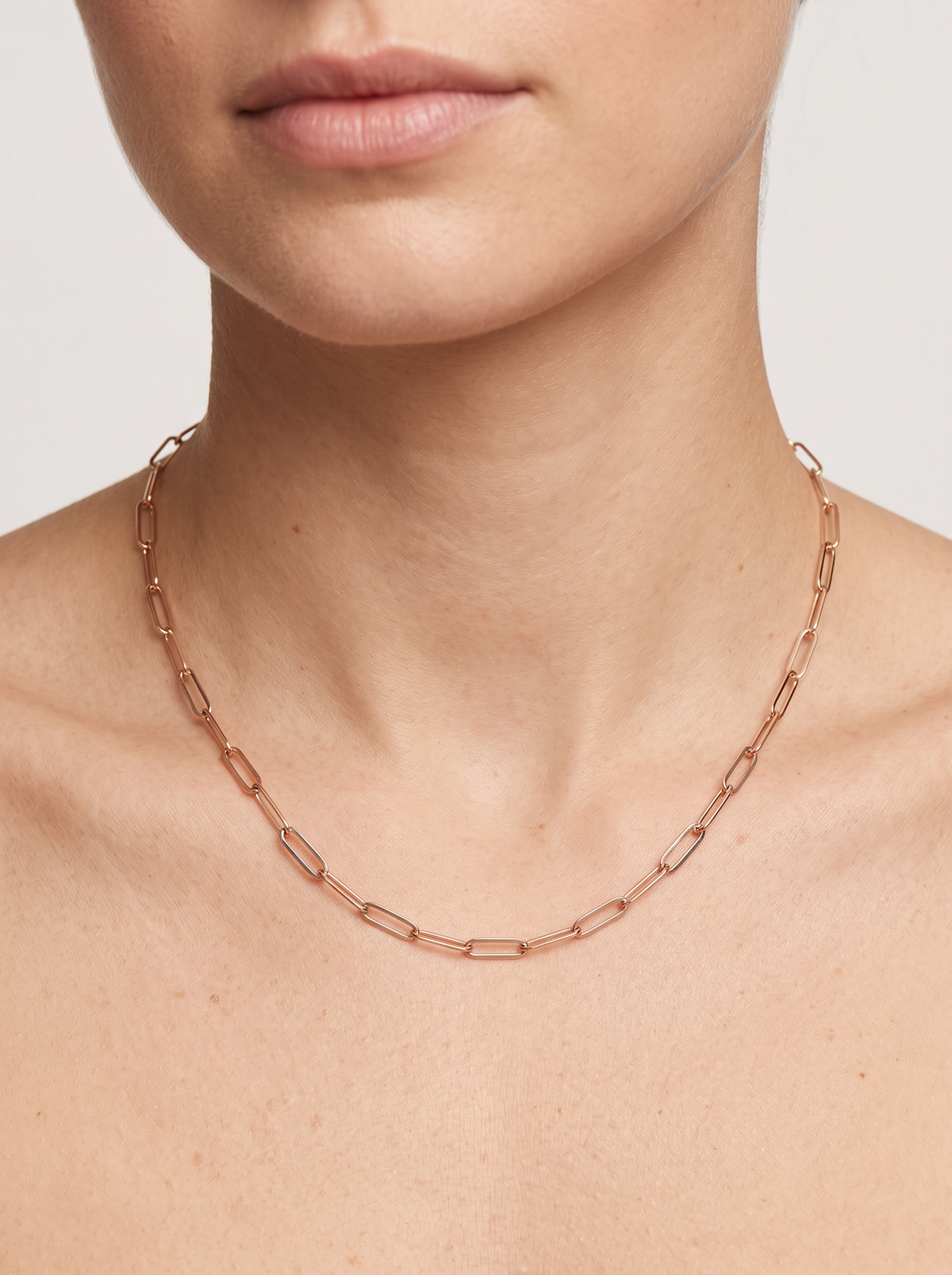 14K Gold Paperclip Chain Necklace in 14K Rose Gold, shown close at the collarbone