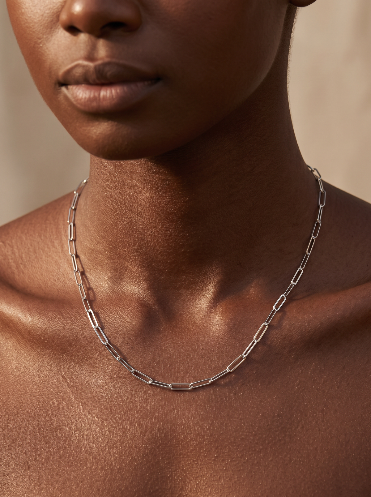 14K Gold Paperclip Chain Necklace in 14K White Gold, shown close at the collarbone