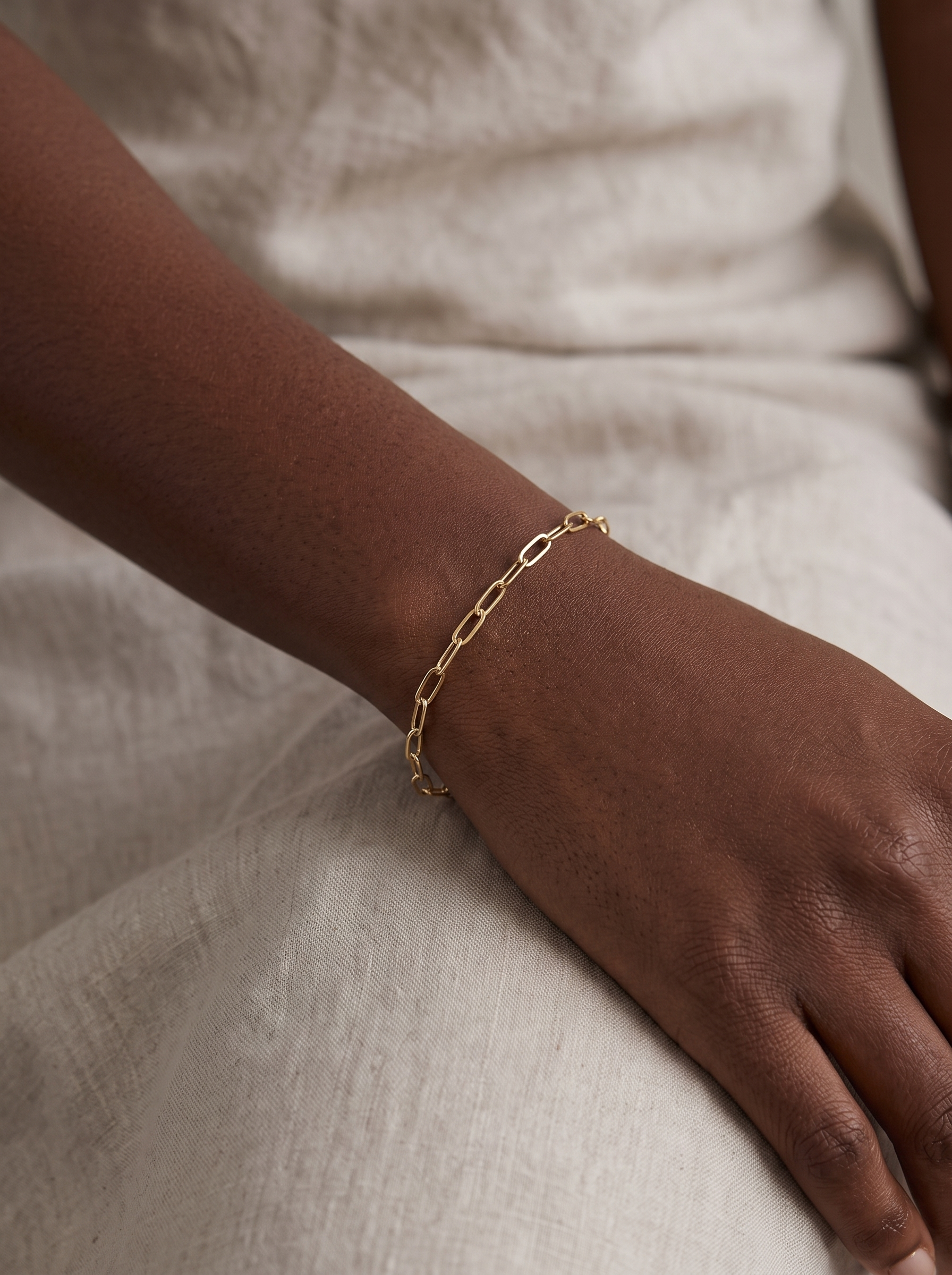 Petite Paperclip Chain Bracelet in 10K Yellow Gold, worn on the wrist