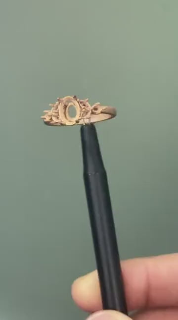 The pink sapphire ring after casting in rose gold, turning