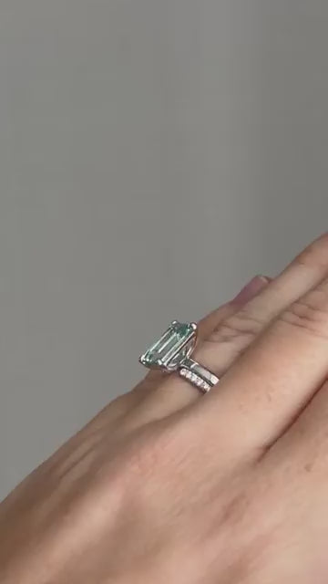 The finished aquamarine ring and its band, worn together