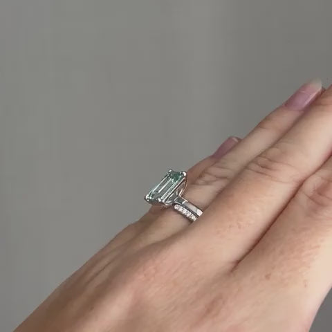 The finished aquamarine ring and its band, worn together
