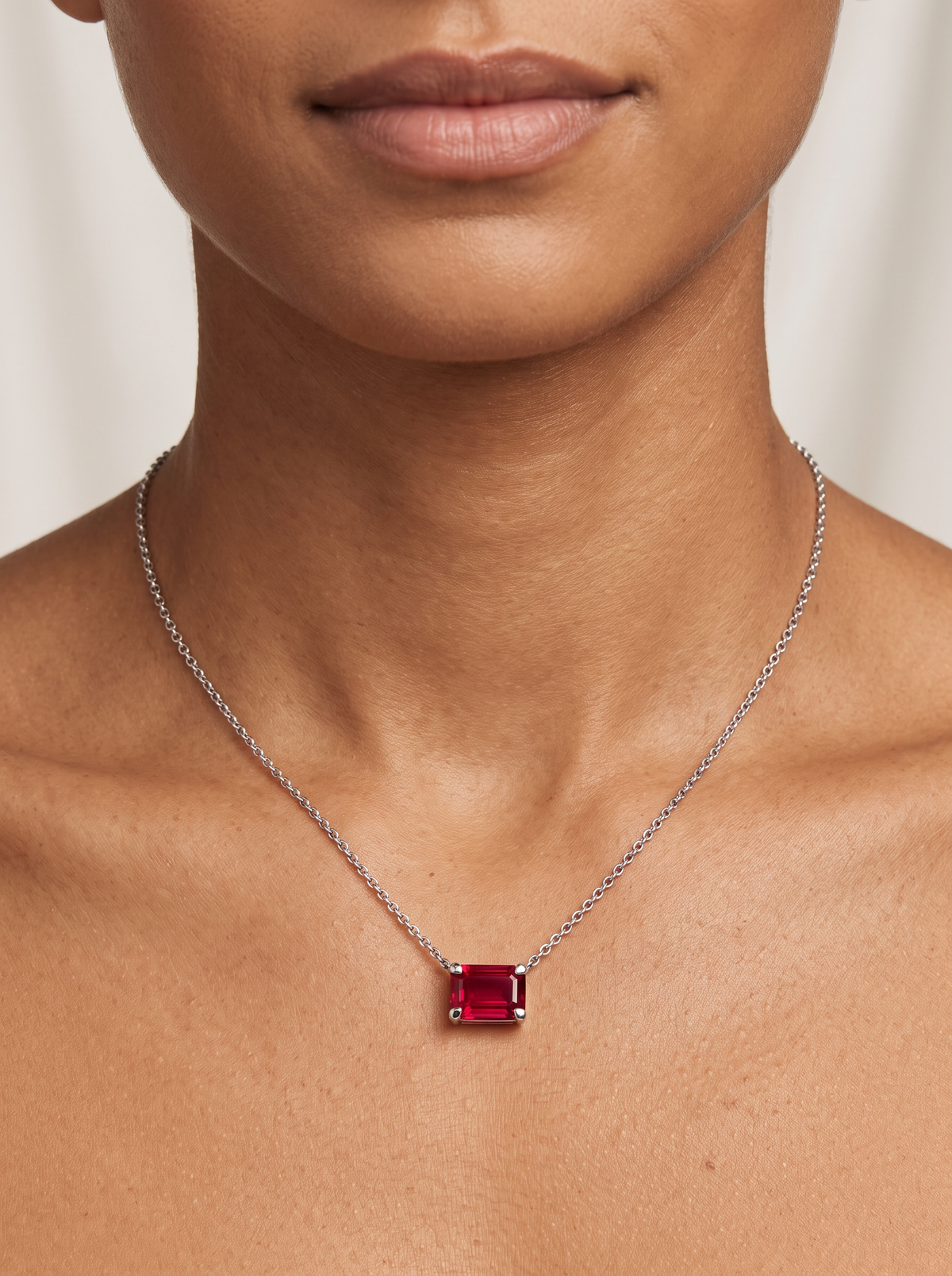 Lab-Grown Emerald-Cut Gemstone Necklace in Platinum, Ruby, shown close at the collarbone