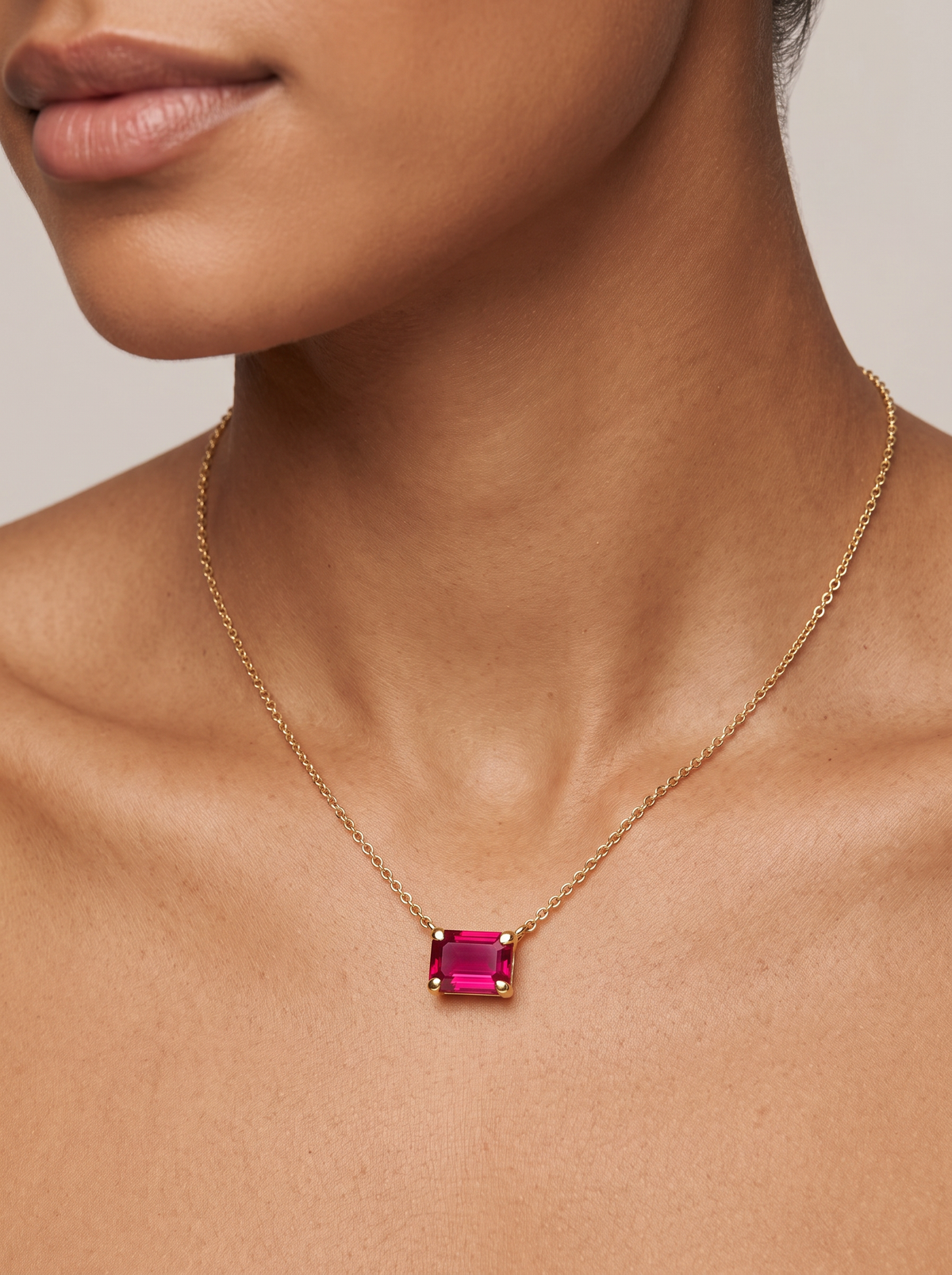 Lab-Grown Emerald-Cut Gemstone Necklace in 14K Yellow Gold, Ruby, shown close at the collarbone