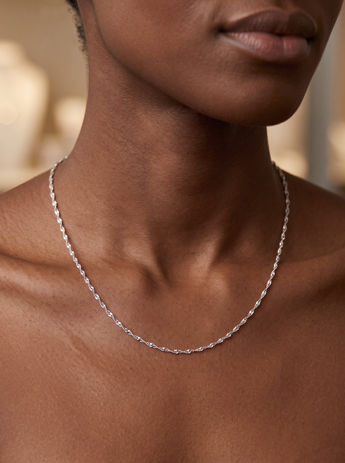 Diamond-Cut Singapore Chain Necklace in 14K White Gold, shown close at the collarbone