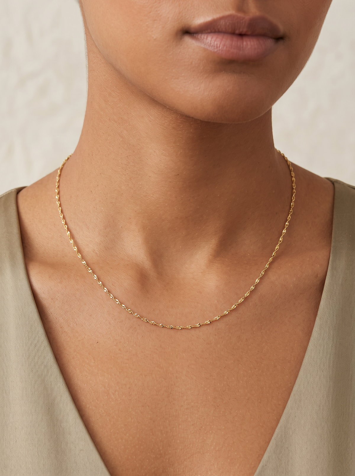 Diamond-Cut Singapore Chain Necklace in 14K Yellow Gold, shown close at the collarbone