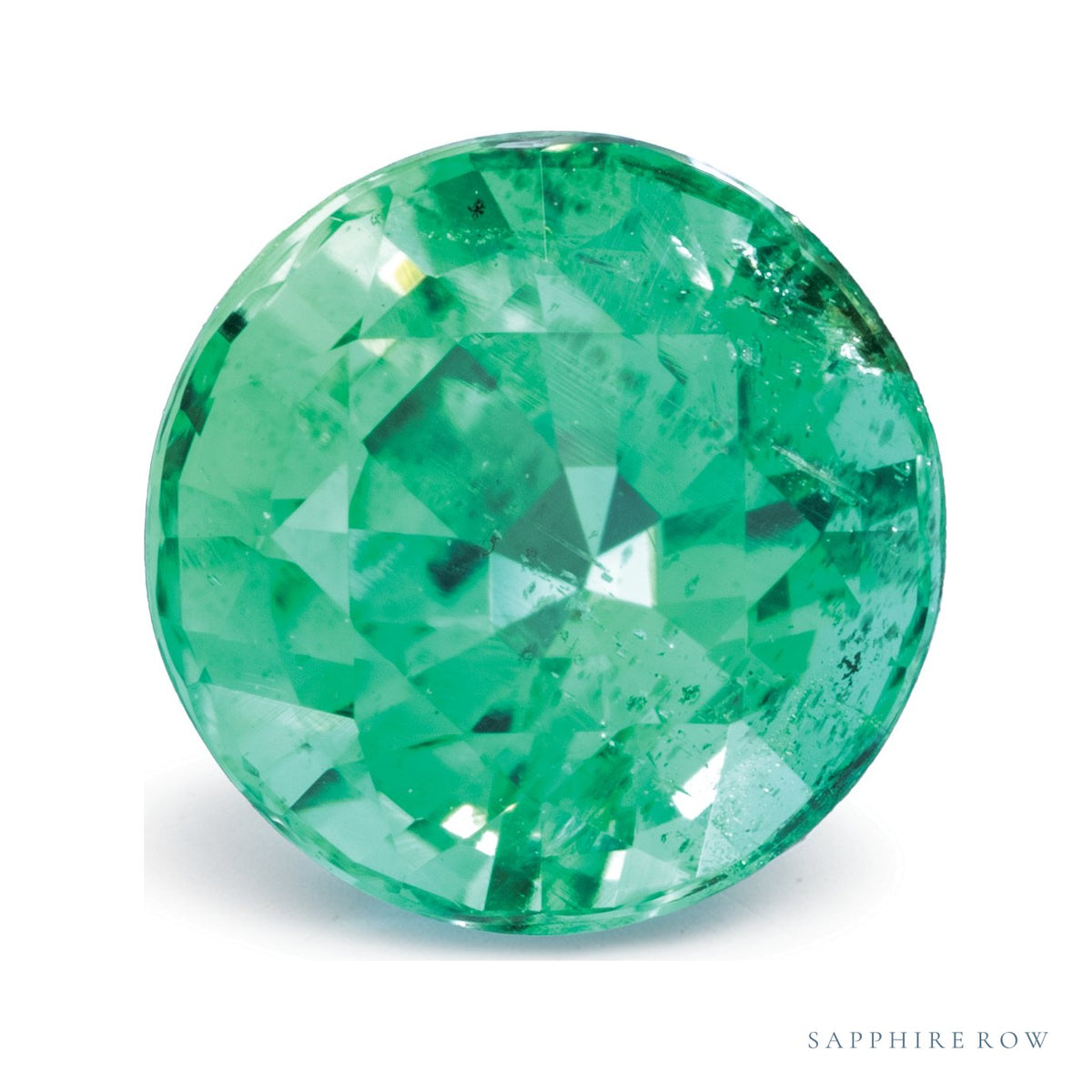 0.97 ct natural green emerald from Zambia, round cut | Sapphire Row · cut7