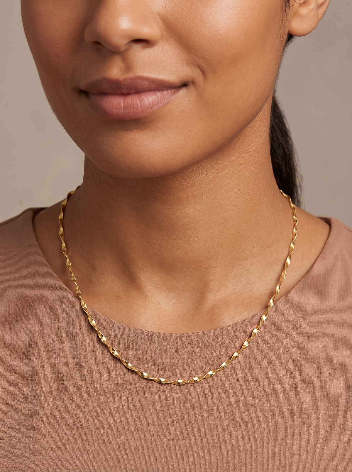 Gold Twisted Herringbone Chain Necklace, shown close at the collarbone