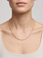 Gold Twisted Herringbone Chain Necklace, worn at the collarbone