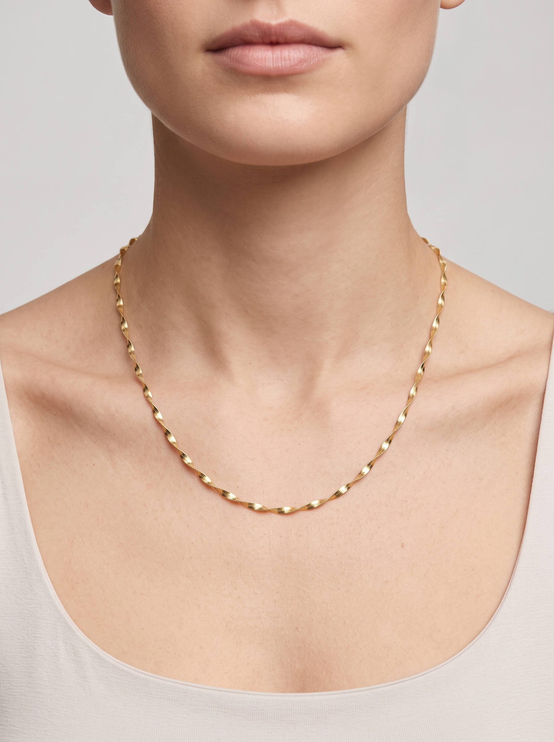 Gold Twisted Herringbone Chain Necklace, worn at the collarbone